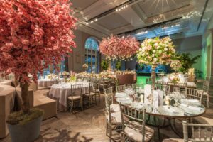 Artificial Cherry Trees Decorating a Luxury Hall for a Wedding Reception